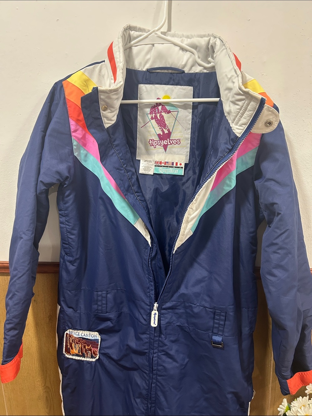 Tipsy Elves Navy Ski Jacket with Rainbow Chevron Accents